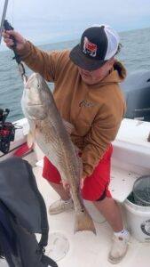 kid in Carhartt, bull redfish