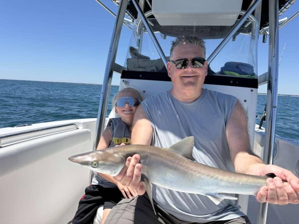 dad and kid with shark