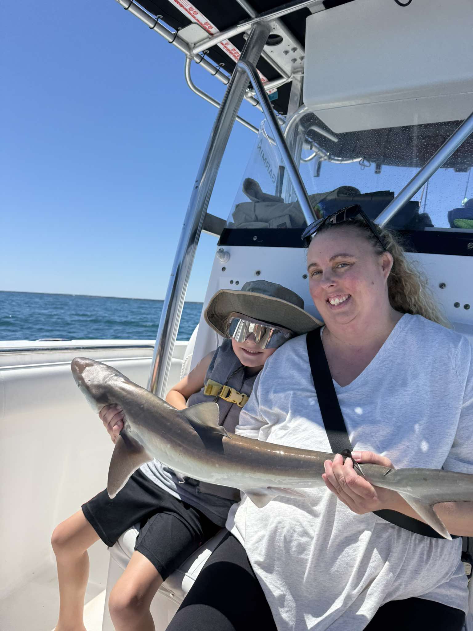 mom and kid with shark