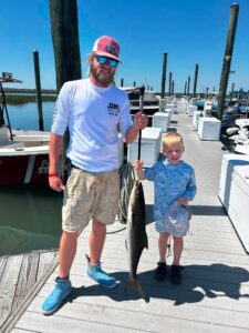 Cobia and boy with Captain