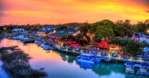 Sunset over the Murrells Inlet MarshWalk with waterfront restaurants and boats